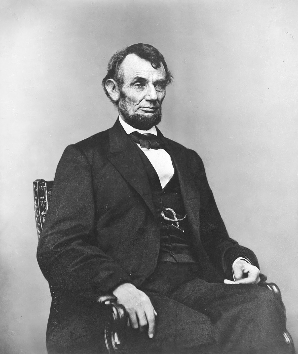 Abraham_Lincoln_seated,_Feb_9,_1864